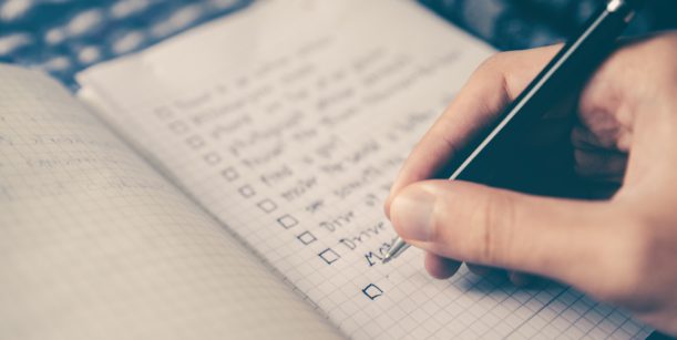 person writing a list