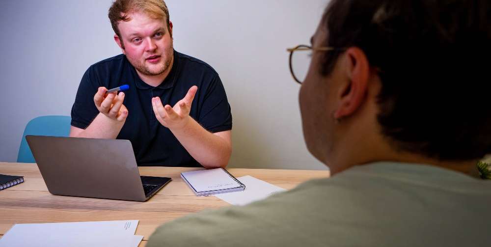 Man Discussing Video with Client