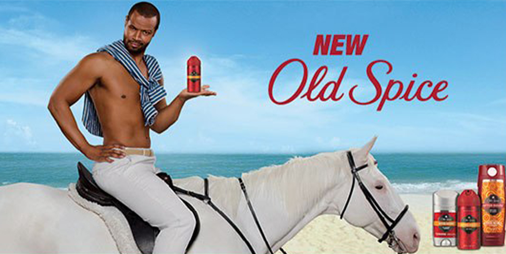 Man sat on a white horse with a bottle of Old Spice for advertising campaign
