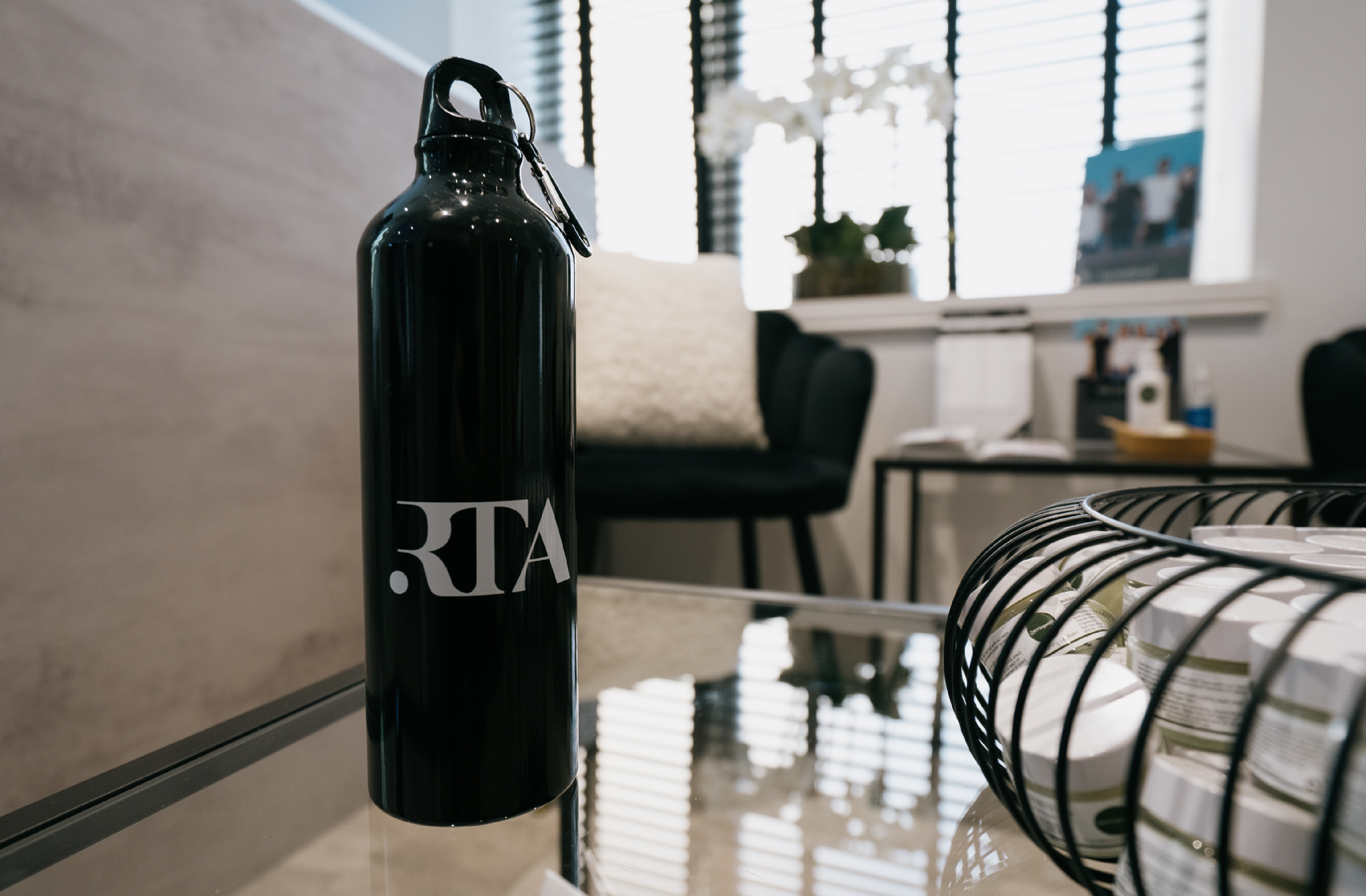 black RTA branded water bottle in salon