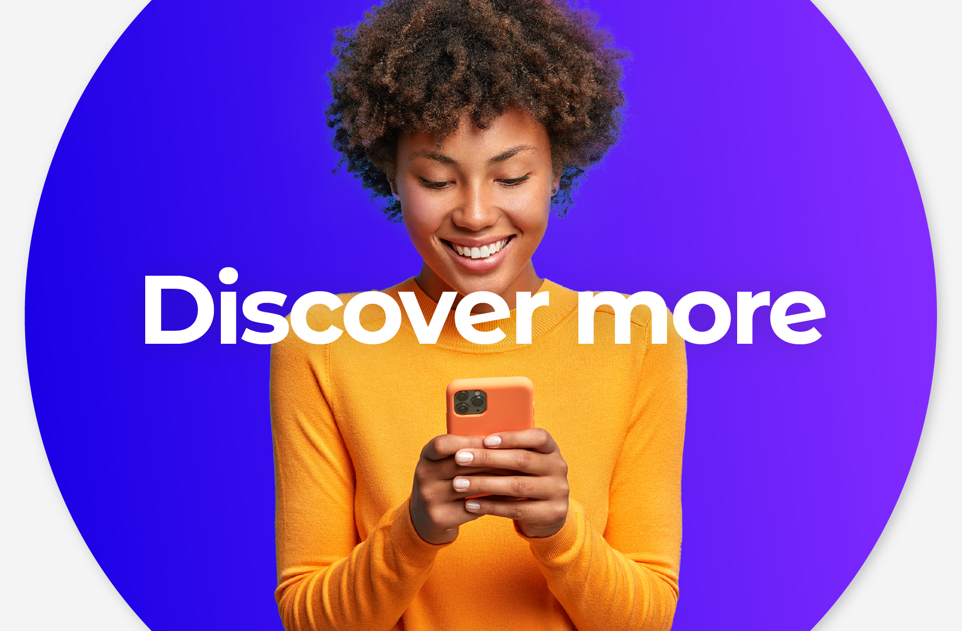woman in orange top using mobile phone