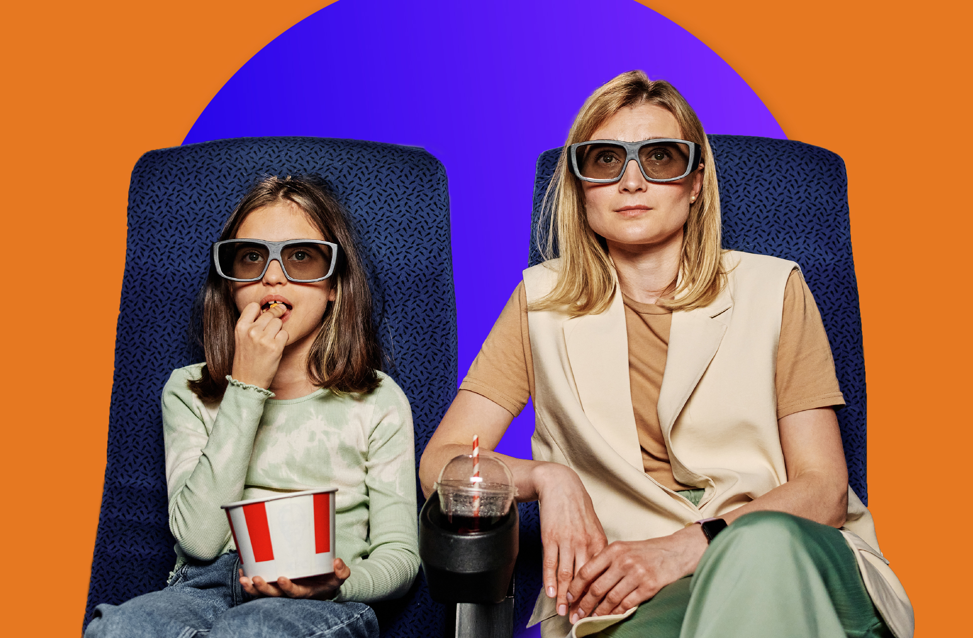 woman and child sat wearing cinema 2D glasses