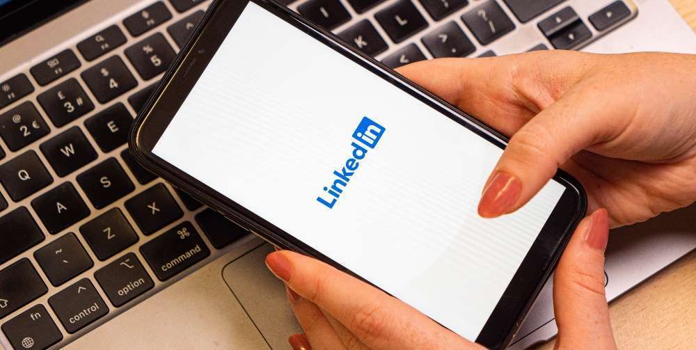 someone using LinkedIn on their mobile phone
